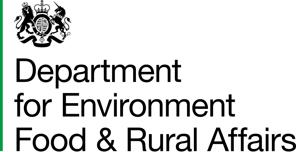 A single thin green vertical line, reminiscent of young shoots in paludiculture, stands on the left edge of a black background. The rest of the image is completely black.