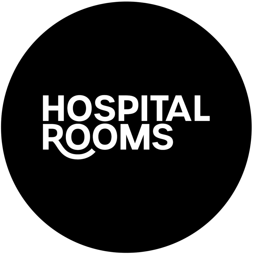 White text on a black background reads "HOSPITAL ROOMS," with the bottom curve of the "R" in "ROOMS" extended to form a smile-like shape, evoking the uplifting murals often found in care spaces.