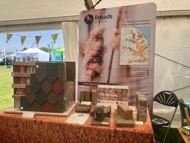 A table with different types of materials on it, including samples from paludiculture practices.