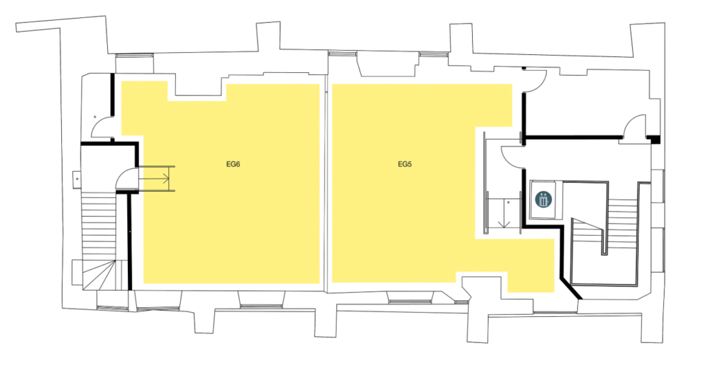 Floor plan showing two large yellow-highlighted rooms labeled E66 and E65, separated by a wall; staircases, doors, and a restroom are visible on both sides of the plan.