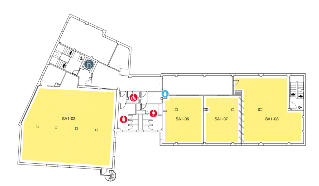 Floor plan with four large yellow rooms labeled SA1-03, SA1-06, SA1-07, and SA1-08. Icons indicate elevators, stairs, accessible restrooms, and emergency exits in central and left areas.