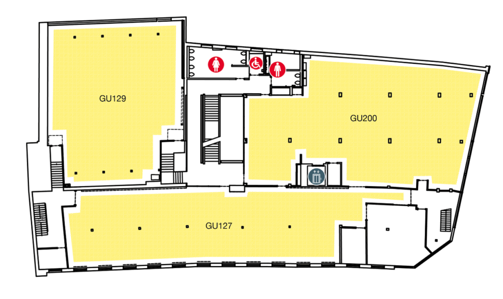 Floor plan showing three large rooms labeled GU129, GU200, and GU127. Restrooms, including accessible facilities, and an elevator are located centrally near the top of the plan. Stairs are at each end.