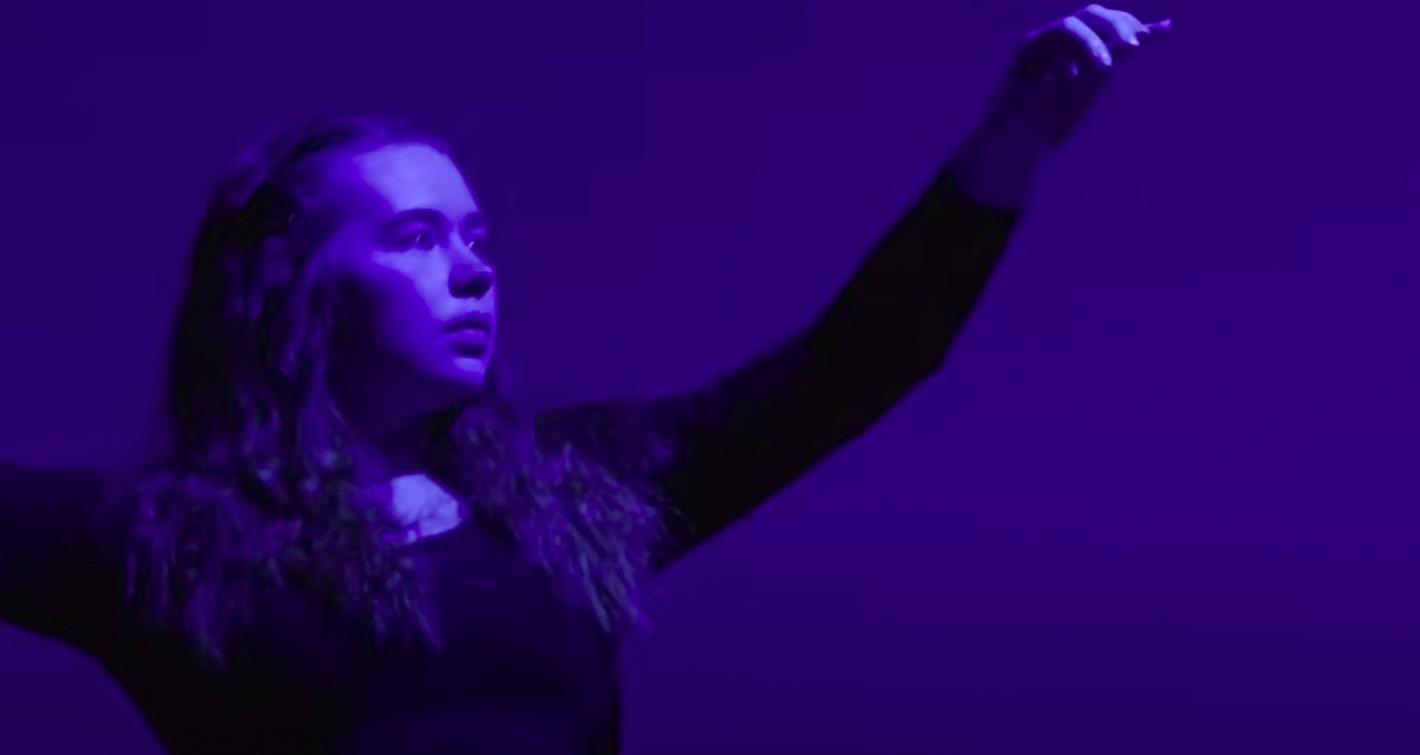 A dancer in blue light