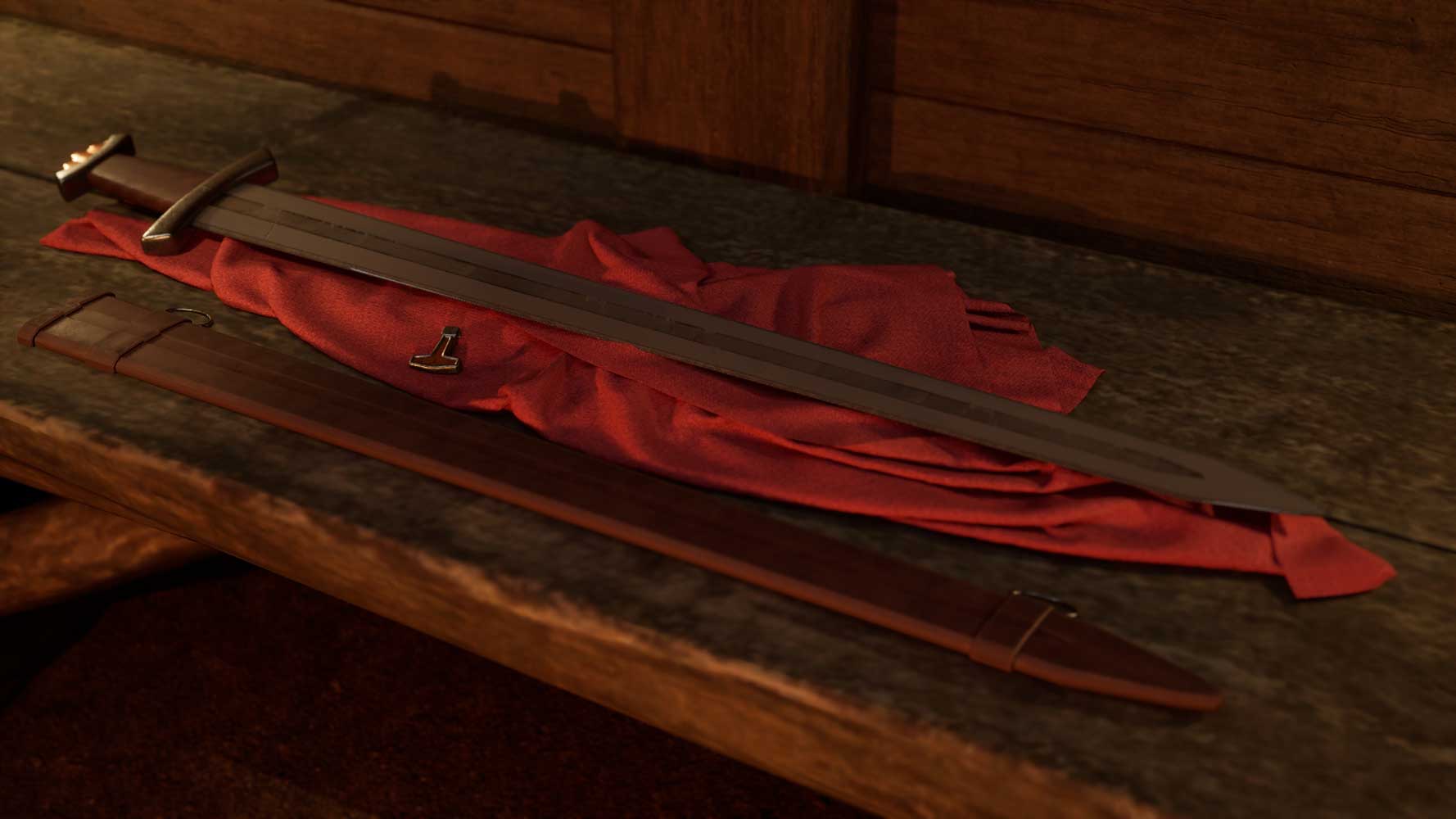 A sword rests on a red cloth on a wooden surface.