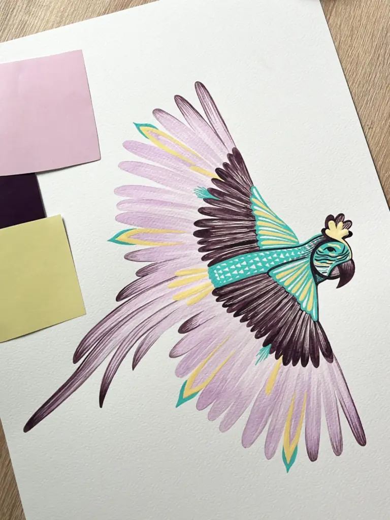 A colorful illustration of a parrot with turquoise, yellow, purple, and black details on white paper. Two sticky notes, one pink and one yellow, are placed on the top left corner of the paper.