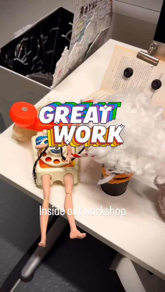 A whimsical desk scene features a toy phone with doll legs, cotton resembling hair, and creative props. The text "GREAT WORK" and "Inside out workshop" are overlaid on the image.
