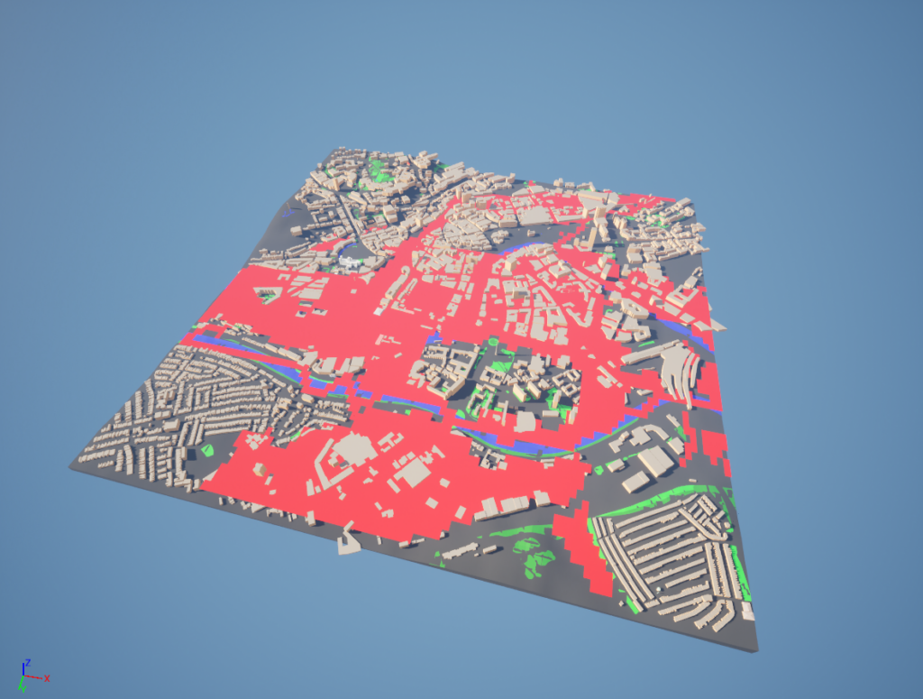 A 3D map view of a city with buildings in white and areas highlighted in red, possibly indicating zones of interest. Green patches suggest parks or vegetation, all set against a blue background.