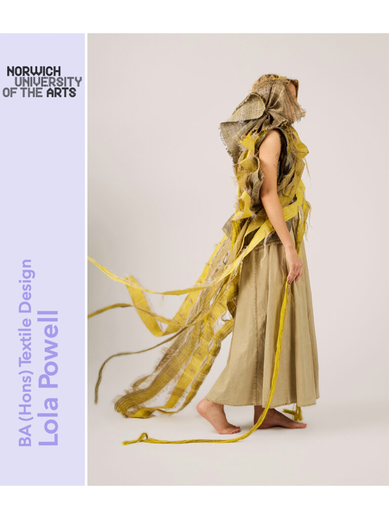 A person wearing a long beige skirt and an elaborate yellow and brown textured headpiece and top stands barefoot against a plain background. Text reads: "Norwich University of the Arts, BA (Hons) Textile Design, Lola Powell.