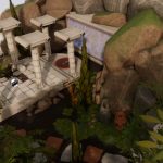 Image of a games environment with stone pillars and greenery