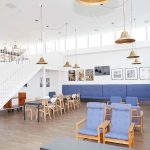 All Saints Green interior showing communal space with chairs and tables at NUA that you can see on the Open Day