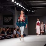 Image of model walking on the catwalk at London Graduate Fashion Week wearing a lasercut design by student Alice Potts