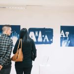 Visitors viewing work in the MA Degree Show