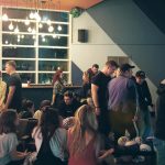 People stand in Bowling House, Norwich