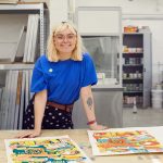 Florence Poppy Dennis stands by her BA Textile Design student work at Norwich University of the Arts in the textiles workshop