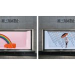 Student work by BA Fashion and Communication and Promotion student Beth Poulter showing visual merchandising in a window with a rainbow and a woman with an umbrella