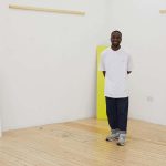 BA Fashion Communication and Promotion student Stephen Gombakomba stands in an empty studio at Norwich University of the Arts