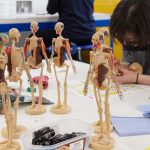 VFX students in the make space create human figures. The figures start with accurate wire models, then have bones to create a realistic skeleton, and students have started creating the rest of the body muscle by muscle