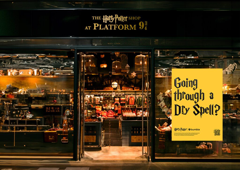 A yellow poster on a black Harry Potter building. 